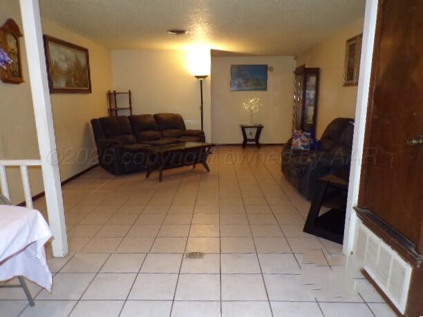 1620 Bluebell Street Amarillo, TX 79107 - Photo 5 of 28 a living room with furniture and a mirror