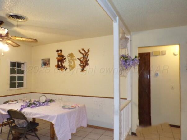 1620 Bluebell Street Amarillo, TX 79107 - Photo 8 of 28 a bedroom with a bed and a table