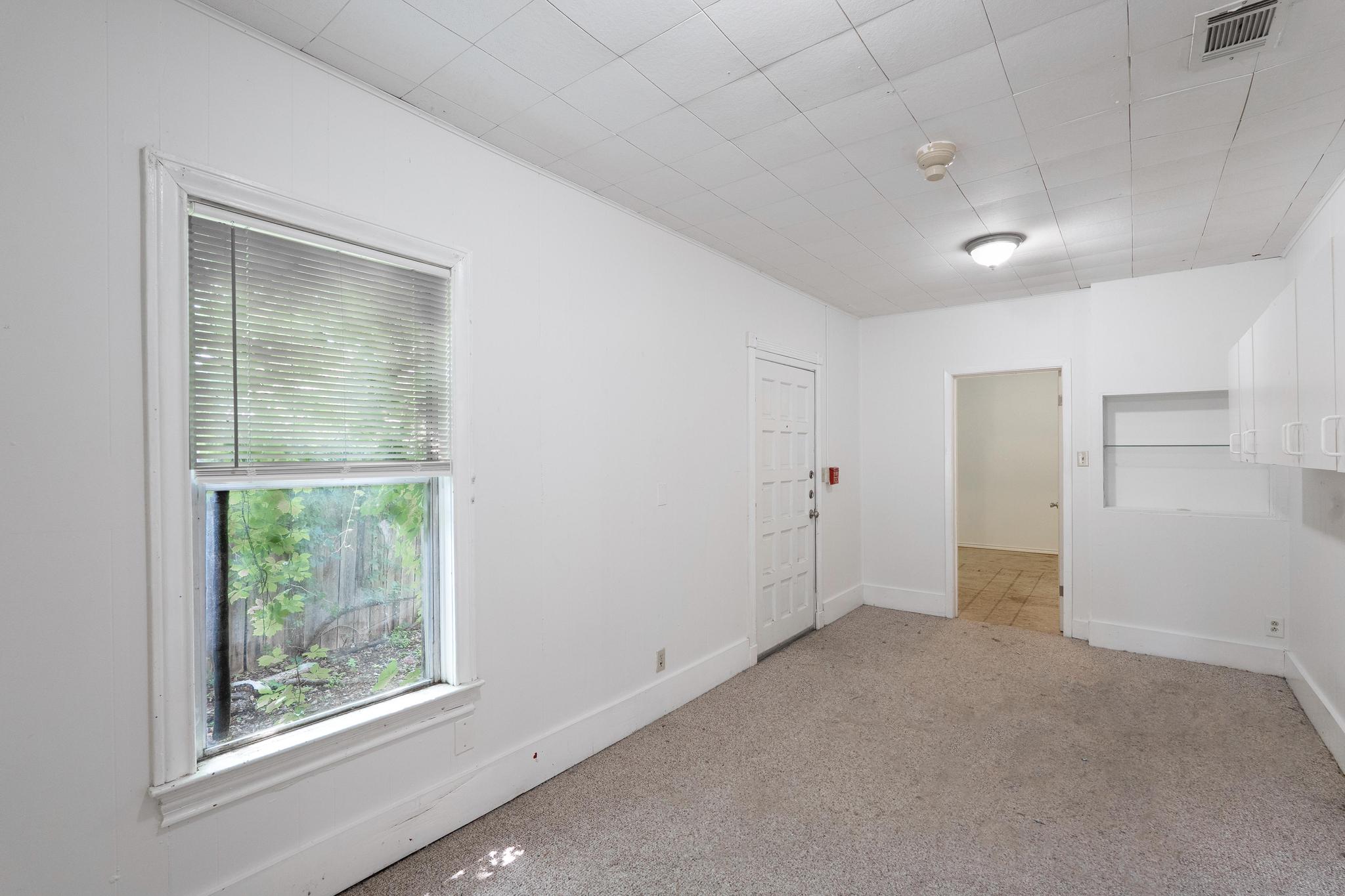 4616 East Cesar Chavez Street Austin, TX 78702 - Photo 6 of 22 an empty room with a window