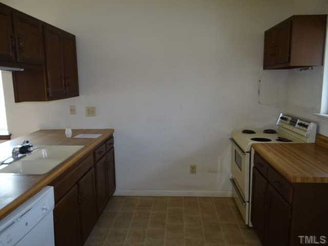 5010 Casa Del Rey Drive Raleigh, NC 27616 - Photo 3 of 10 a utility room with sink dryer and washer