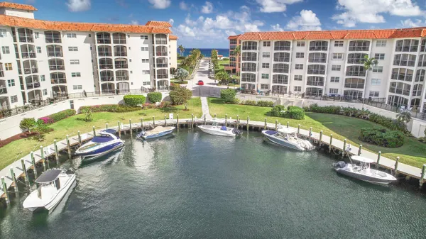 a view of swimming pool with outdoor seating and lake view