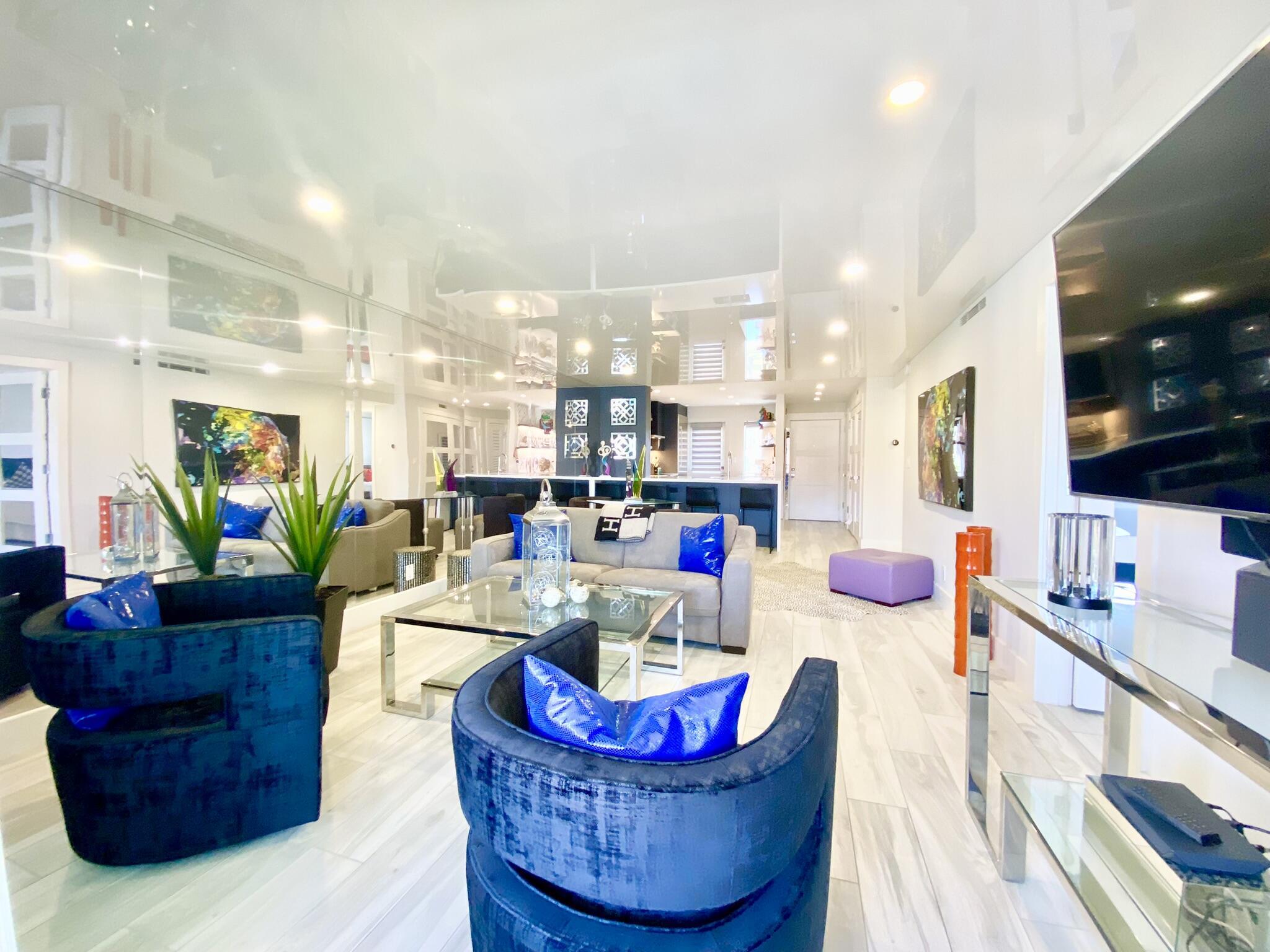 2871 North Ocean Boulevard, Unit M330 Boca Raton, FL 33431 - Photo 12 of 60 a living room with furniture and a flat screen tv