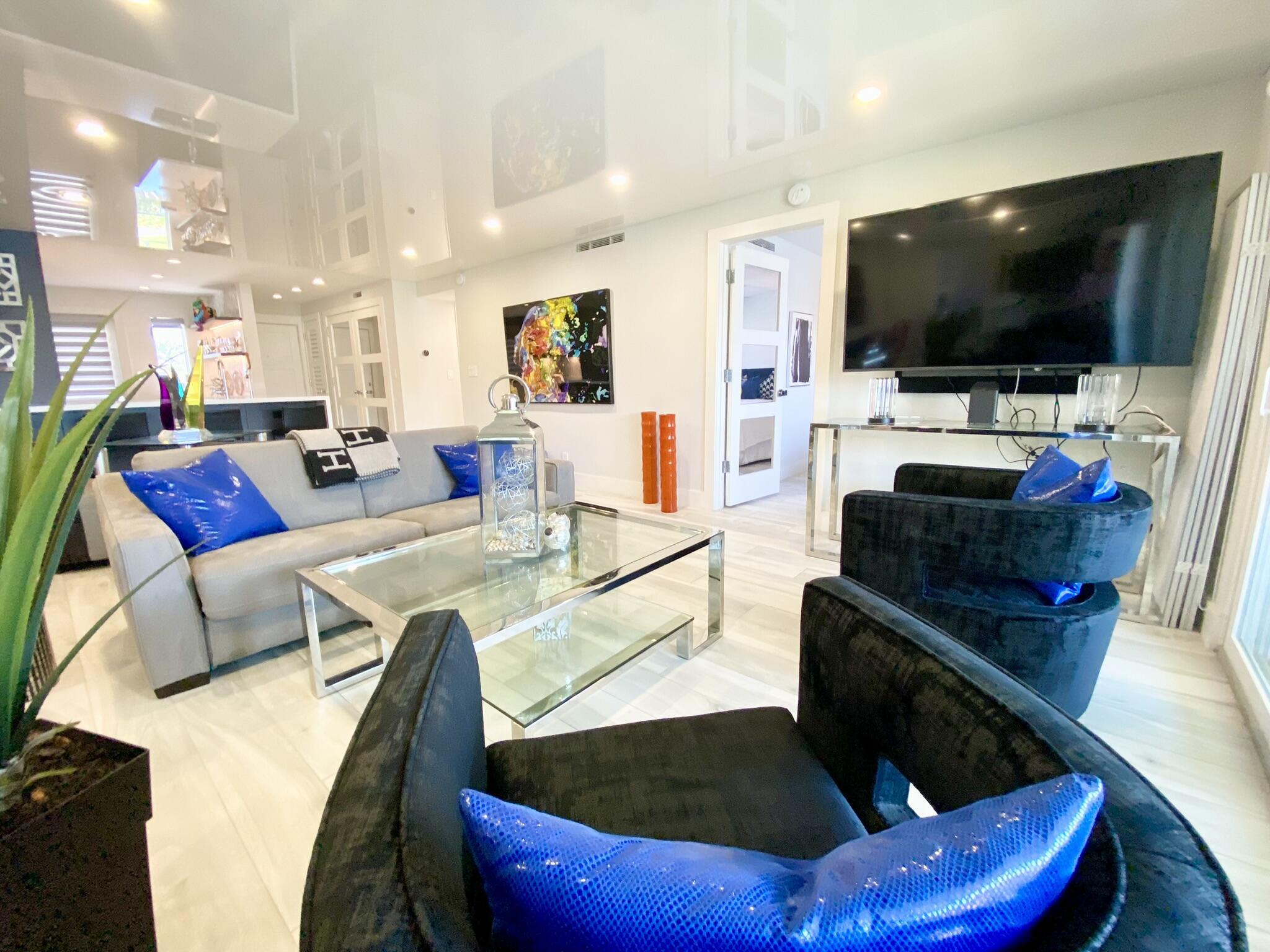 2871 North Ocean Boulevard, Unit M330 Boca Raton, FL 33431 - Photo 16 of 60 a living room with furniture and a flat screen tv