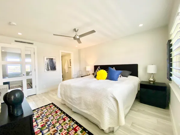 a bathroom with a sink double vanity and a mirror