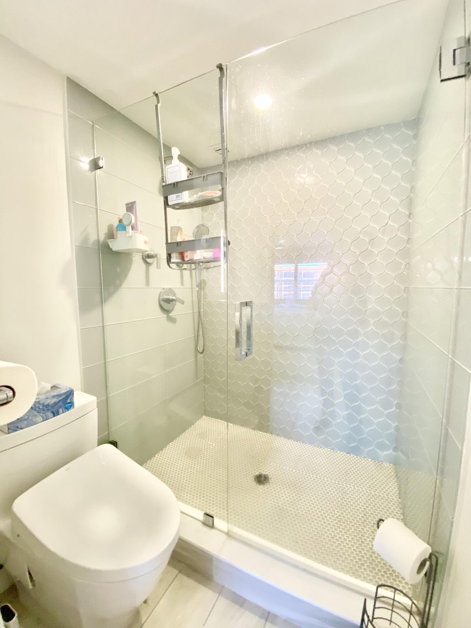 2871 North Ocean Boulevard, Unit M330 Boca Raton, FL 33431 - Photo 22 of 60 a bathroom with a sink a toilet and shower