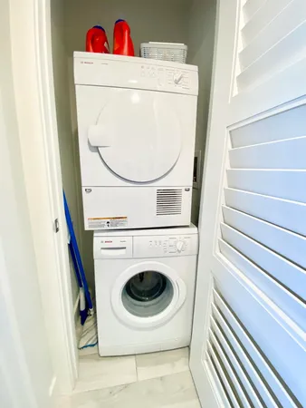 a view of a swimming pool with a patio and a garden