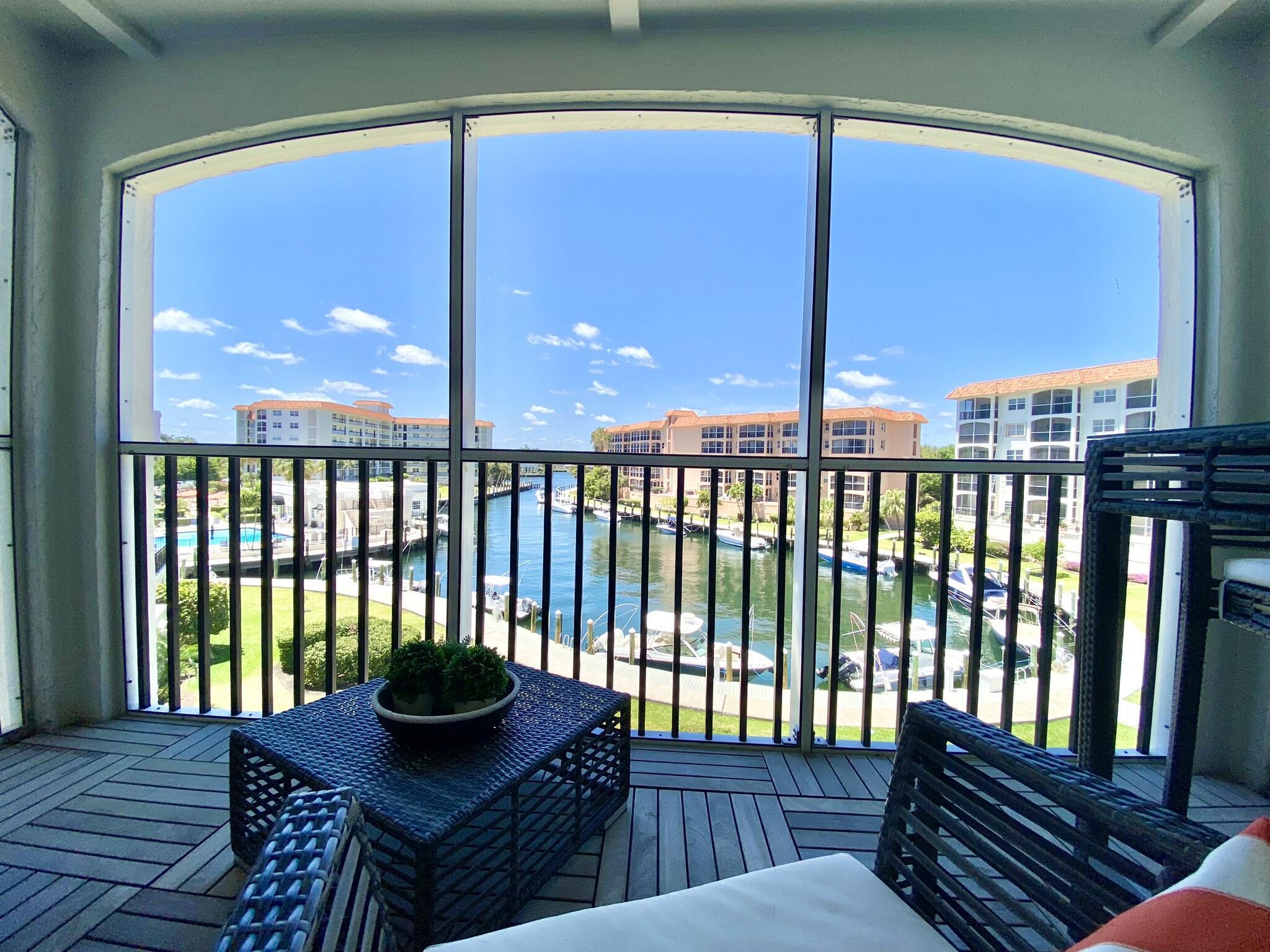 2871 North Ocean Boulevard, Unit M330 Boca Raton, FL 33431 - Photo 31 of 60 a view of a chairs and table in the balcony