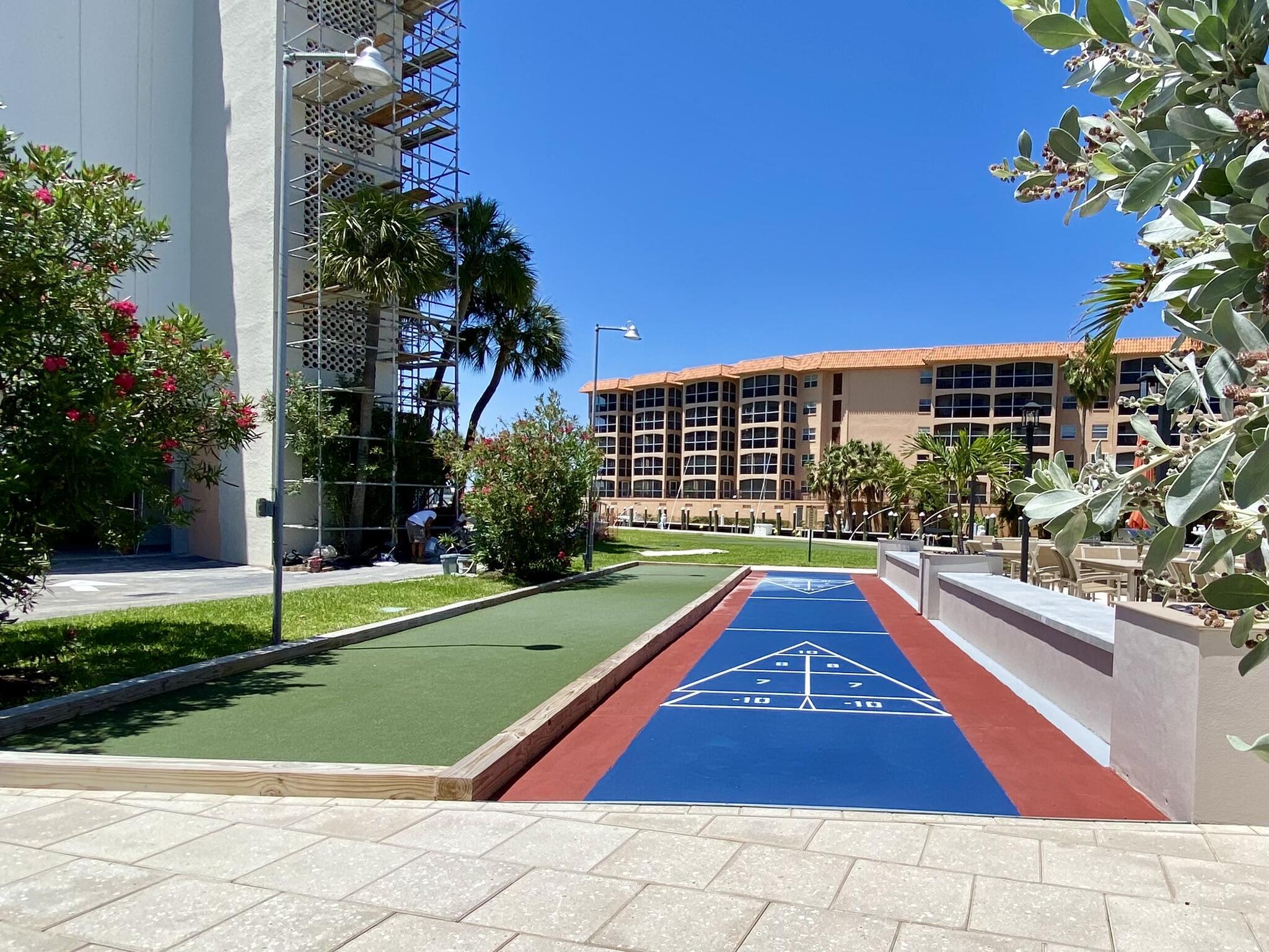 2871 North Ocean Boulevard, Unit M330 Boca Raton, FL 33431 - Photo 36 of 60 a view of swimming pool with a yard and potted plants
