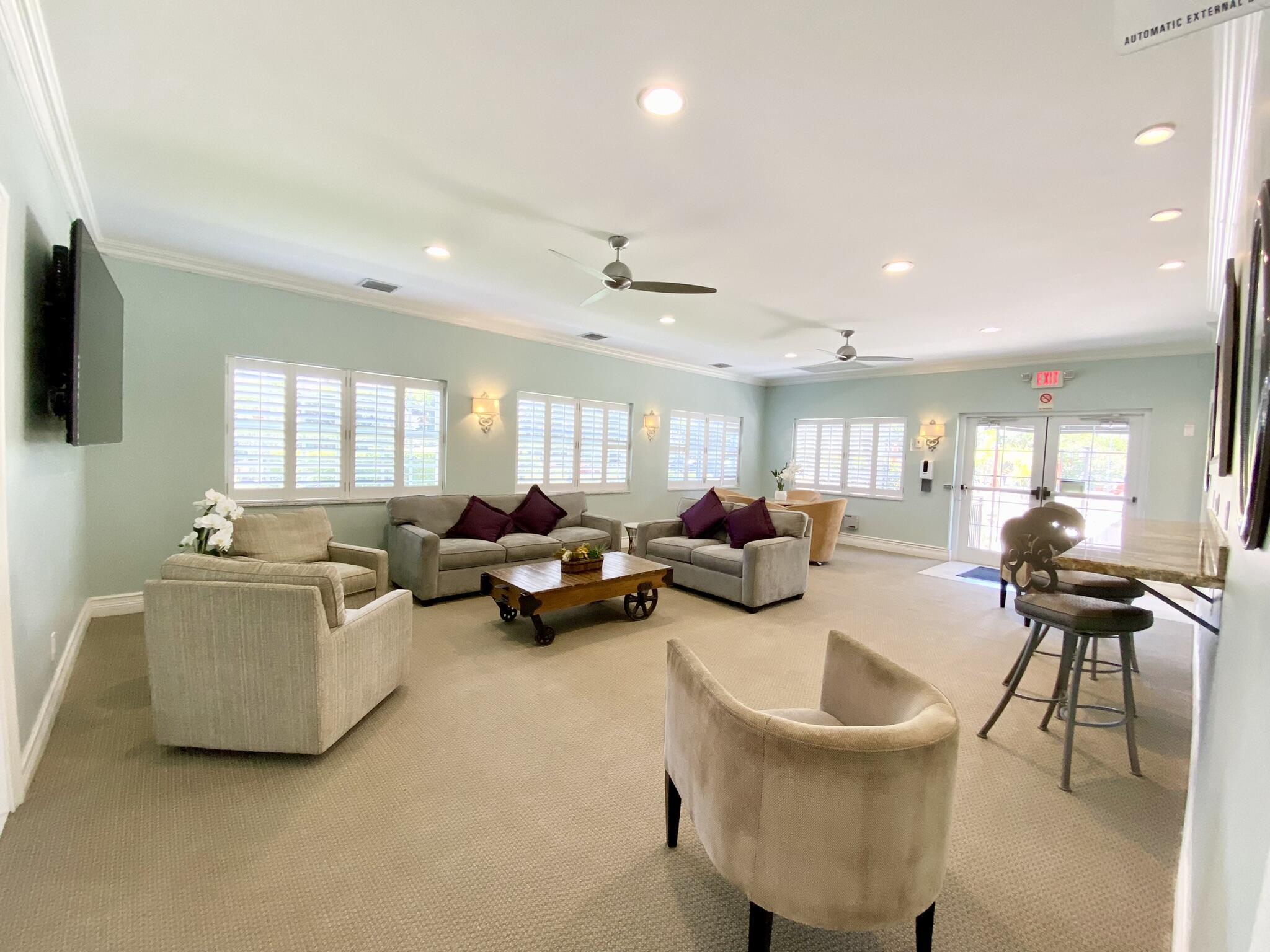 2871 North Ocean Boulevard, Unit M330 Boca Raton, FL 33431 - Photo 40 of 60 a living room with furniture and a flat screen tv