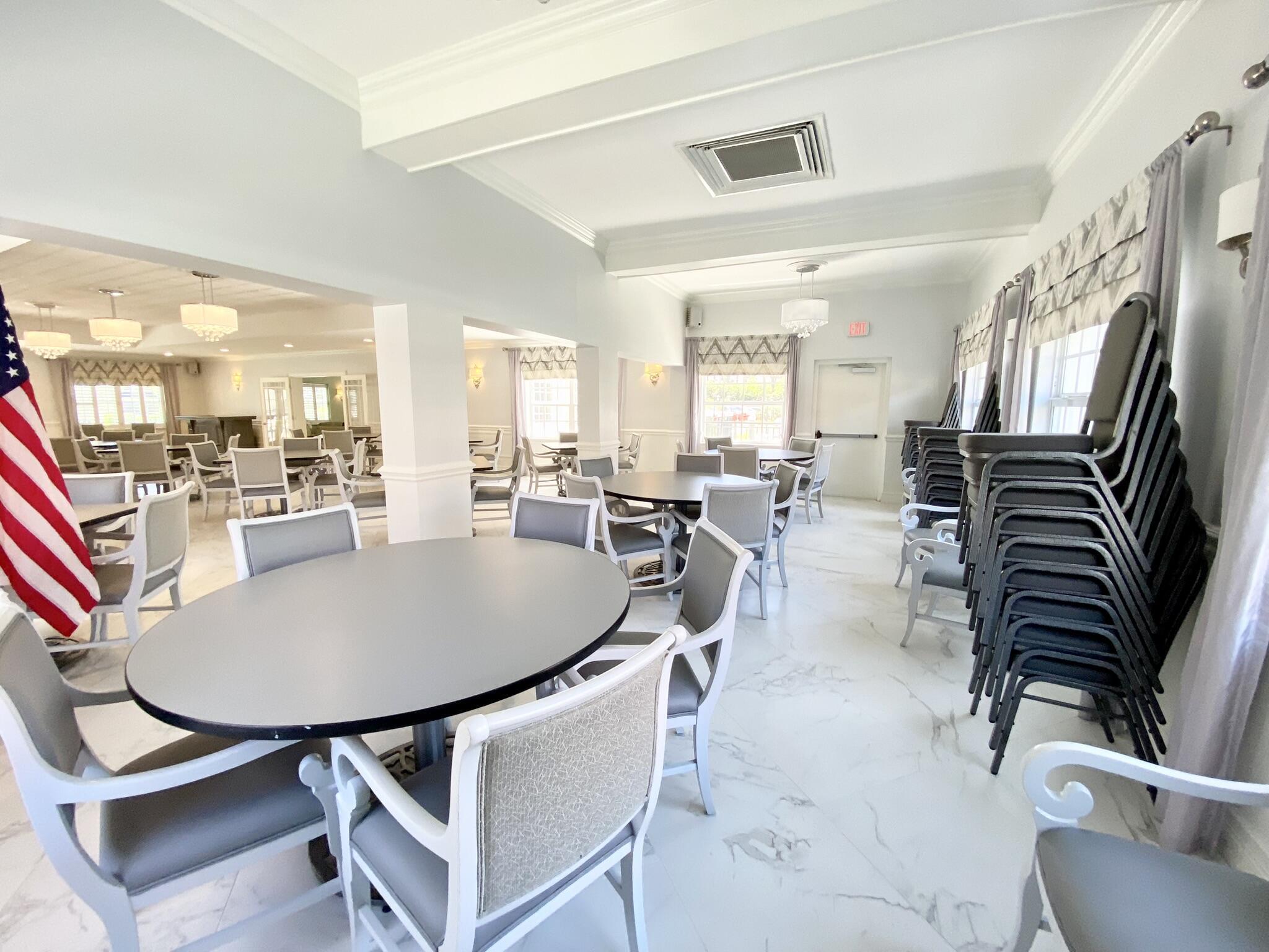 2871 North Ocean Boulevard, Unit M330 Boca Raton, FL 33431 - Photo 46 of 60 a dining room with furniture and wooden floor
