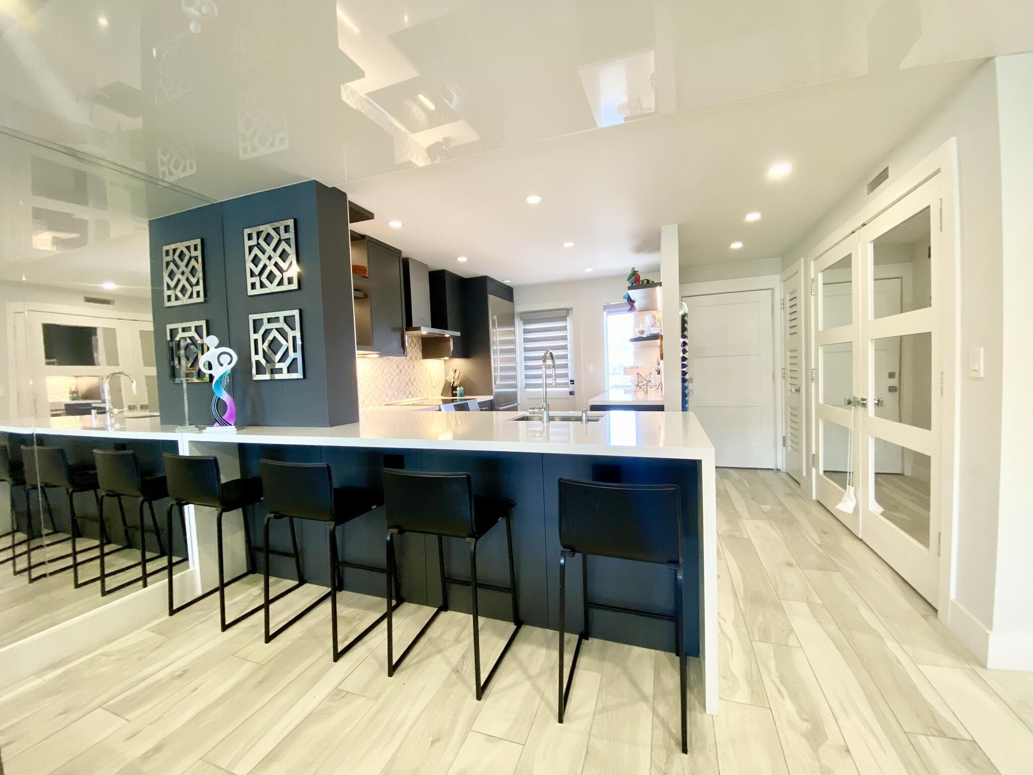 2871 North Ocean Boulevard, Unit M330 Boca Raton, FL 33431 - Photo 8 of 60 a living room with stainless steel appliances kitchen island granite countertop furniture and a kitchen view