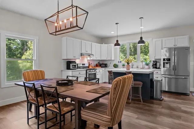 a kitchen with a refrigerator a sink dishwasher a stove and a refrigerator