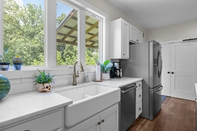 a bathroom with a sink a vanity and a mirror