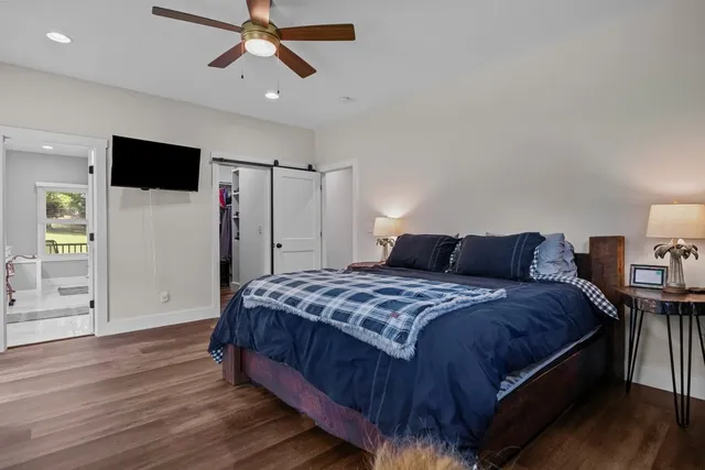a bathroom with a tub and a window