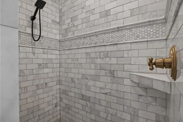 a living room with a bed furniture and a window