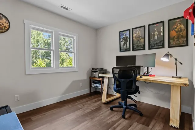 a bathroom with a sink toilet and a mirror