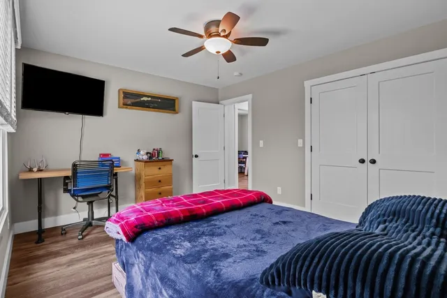 a view of a house with backyard and porch