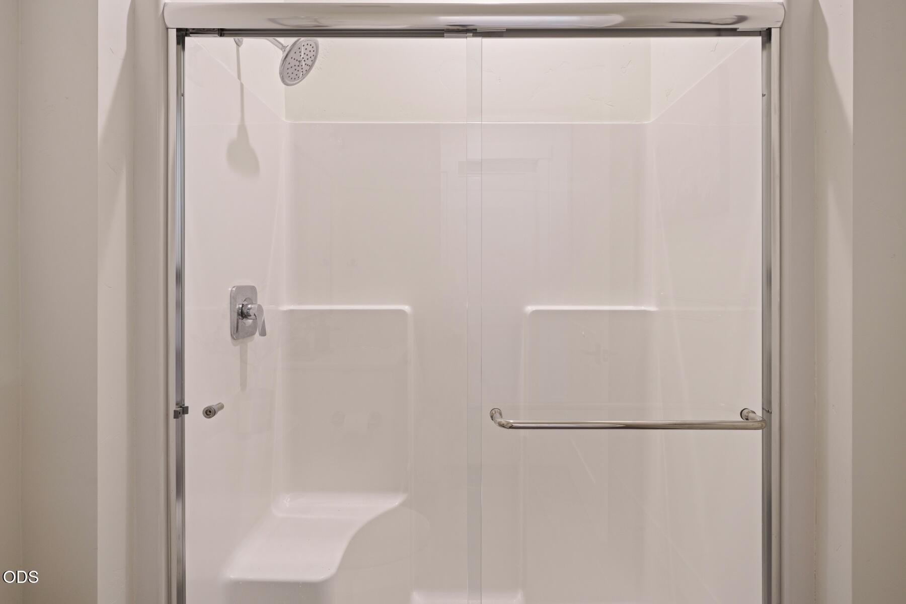 60255 Sunset View Drive Bend, OR 97702 - Photo 33 of 48 a bathroom with a glass shower door