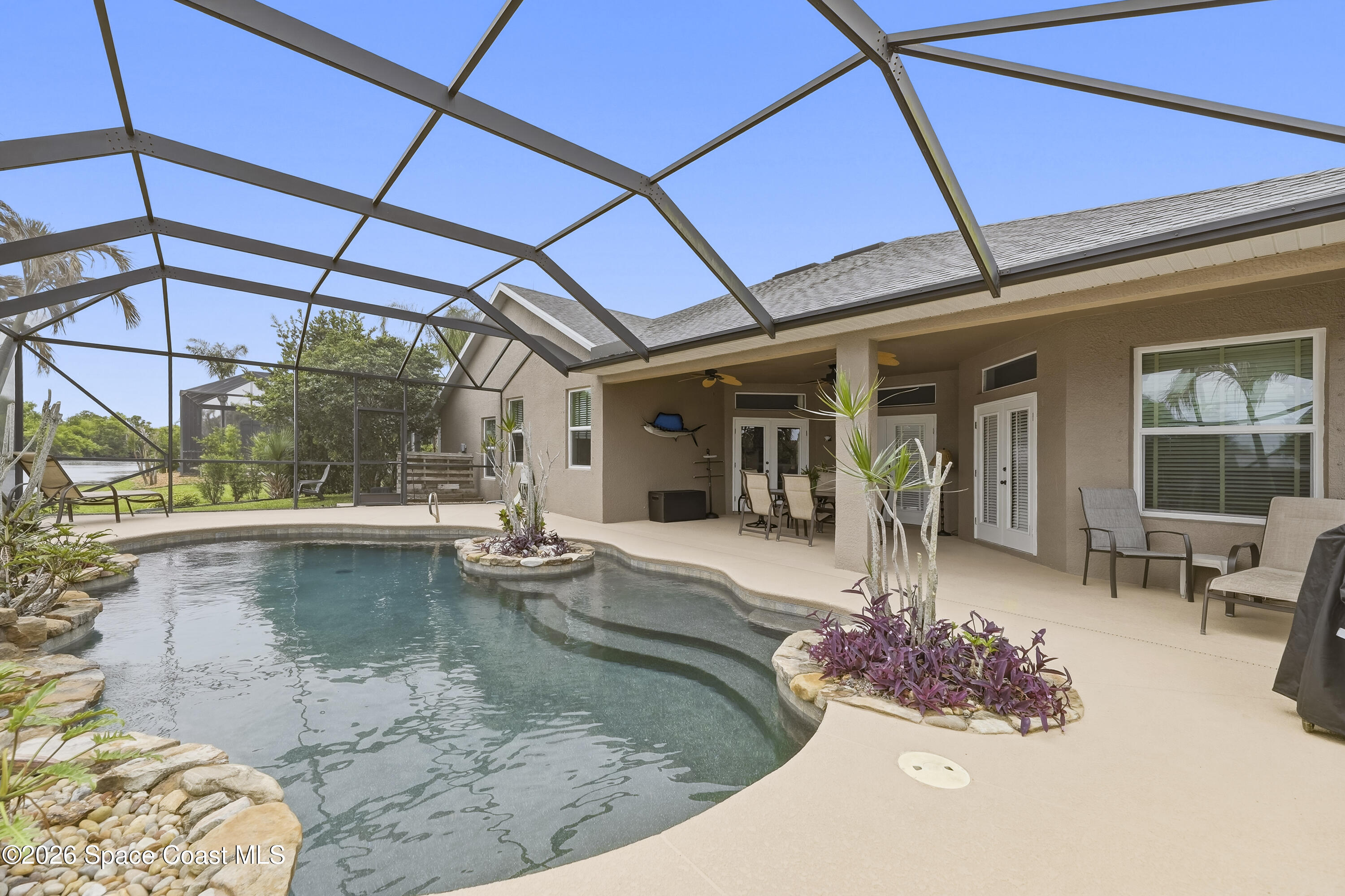 1643 Long Pine Road Melbourne, FL 32940 - Photo 47 of 63 a view of a swimming pool with a patio