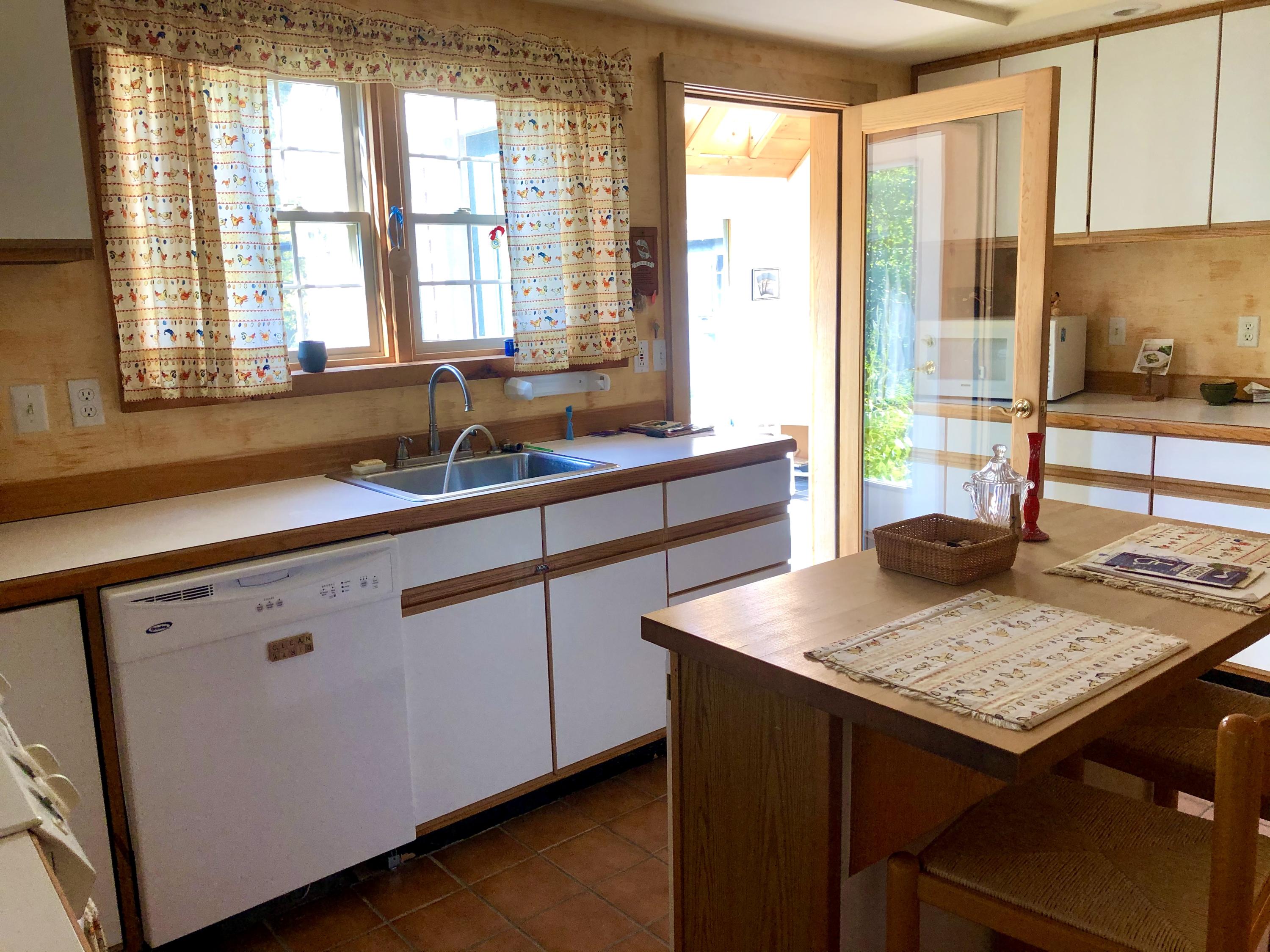 10 Dodge Point Road Tremont, ME 04612 - Photo 22 of 49 Kitchen connects to sunroom as well