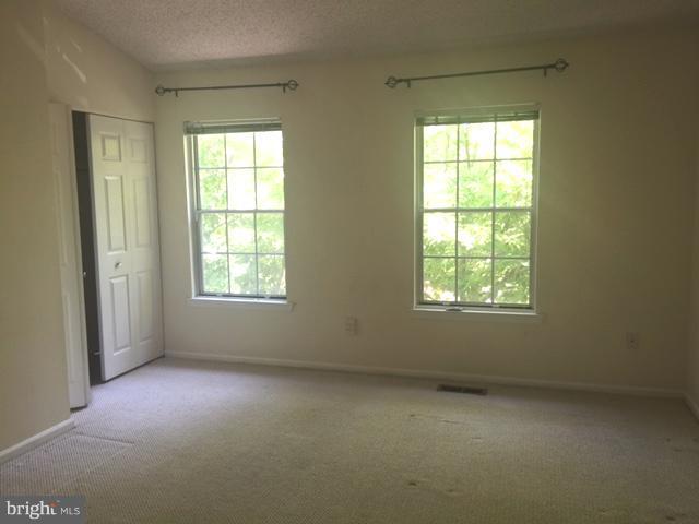 6527 Cypress Point Road Alexandria, VA 22312 - Photo 12 of 16 an empty room with a window