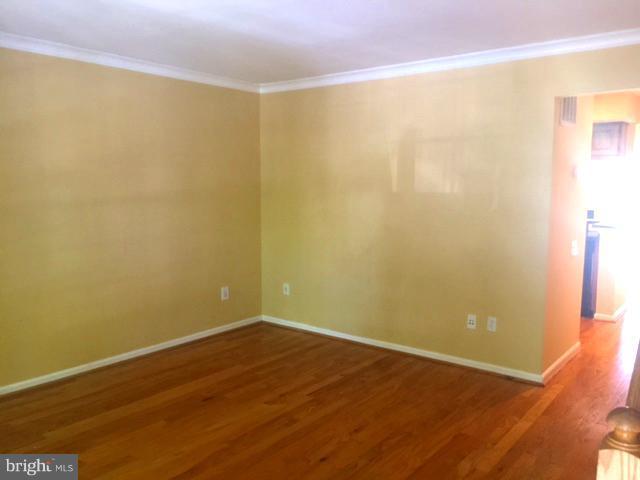 6527 Cypress Point Road Alexandria, VA 22312 - Photo 5 of 16 a view of a small space with wooden floor and a window