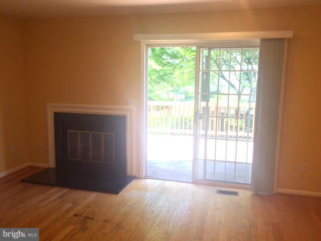 6527 Cypress Point Road Alexandria, VA 22312 - Photo 6 of 16 a view of an empty room and window