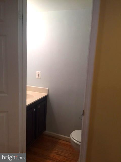 6527 Cypress Point Road Alexandria, VA 22312 - Photo 7 of 16 a bathroom with a sink and a toilet