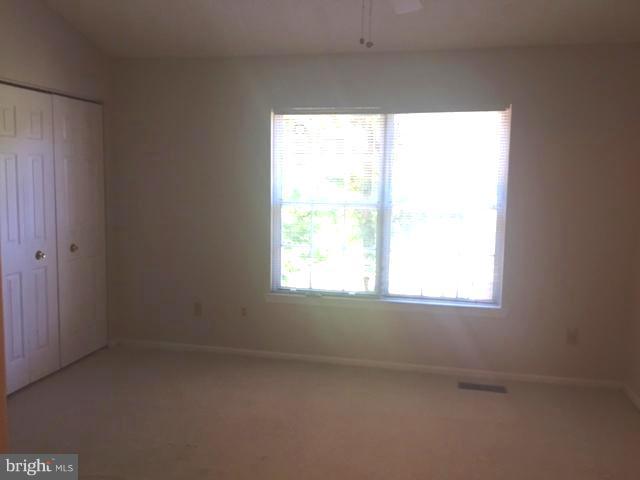 6527 Cypress Point Road Alexandria, VA 22312 - Photo 8 of 16 an empty room with a window