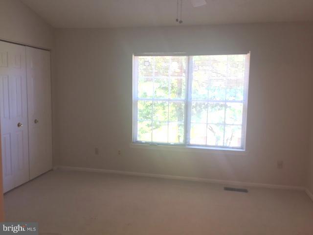 6527 Cypress Point Road Alexandria, VA 22312 - Photo 10 of 16 an empty room with a window