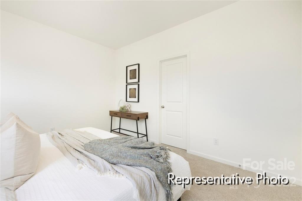 321 Copes Court, Unit 48 Kannapolis, NC 28081 - Photo 6 of 18 a bedroom with a bed and a table