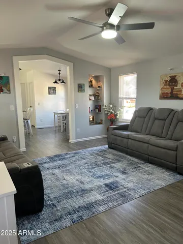 a view of a dining room with furniture and wooden floor