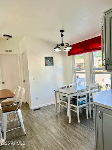 a kitchen with a sink a stove and cabinets