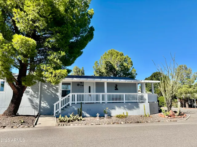 front view of a house with a chairs