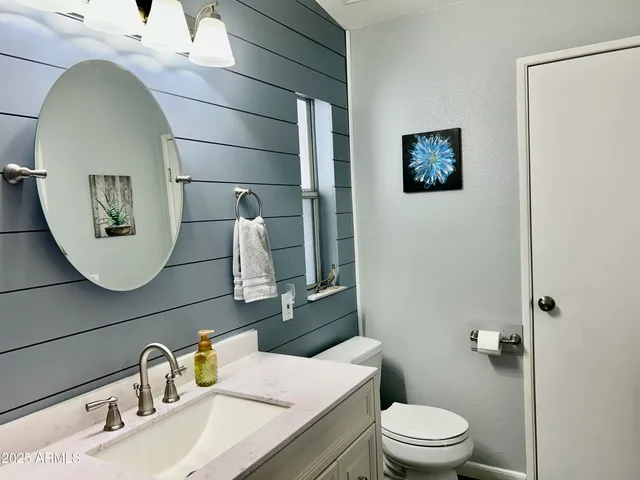 a bathroom with a shower and a sink