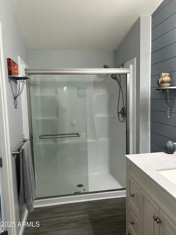 a view of livingroom with hardwood floor and a sink