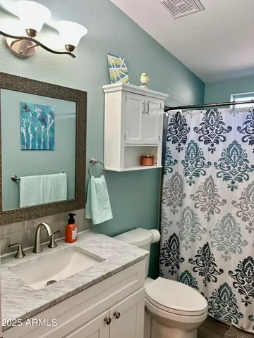 a bathroom with a bathtub and a window