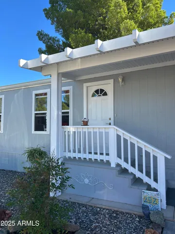 a view of a house with a small yard