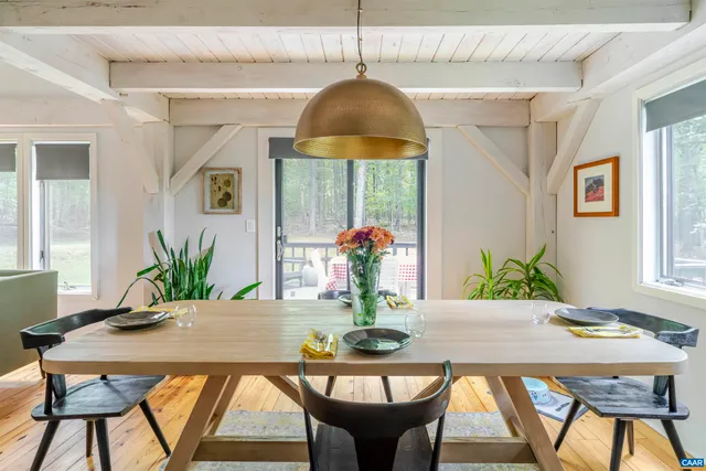 a table room with a table and chairs