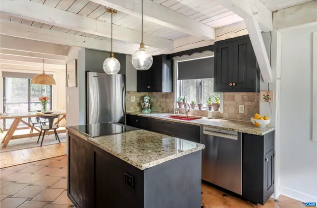 a kitchen with a table and chairs in it