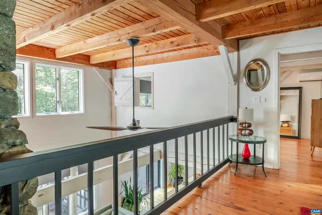 a view of a porch with wooden floor