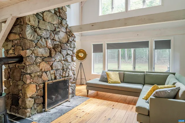 a living room with a couch and a fireplace