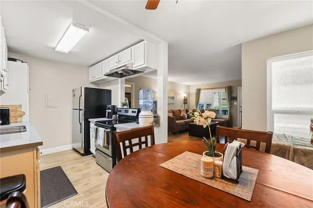 a kitchen with a stove a sink and a refrigerator