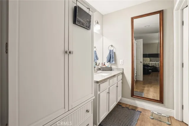 a en suite bathroom with a sink and a mirror