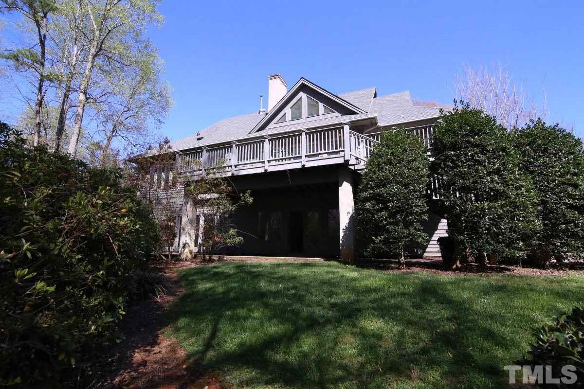 8800 Old Tom Way Raleigh, NC 27613 - Photo 20 of 25 a front view of a house with a yard