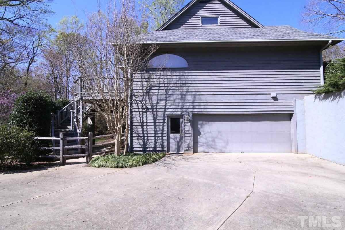 8800 Old Tom Way Raleigh, NC 27613 - Photo 21 of 25 a front view of a house with parking area