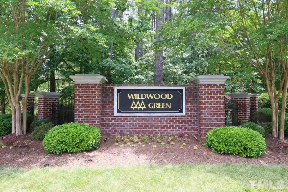 8800 Old Tom Way Raleigh, NC 27613 - Photo 25 of 25 a sign that is sitting in front of a brick house