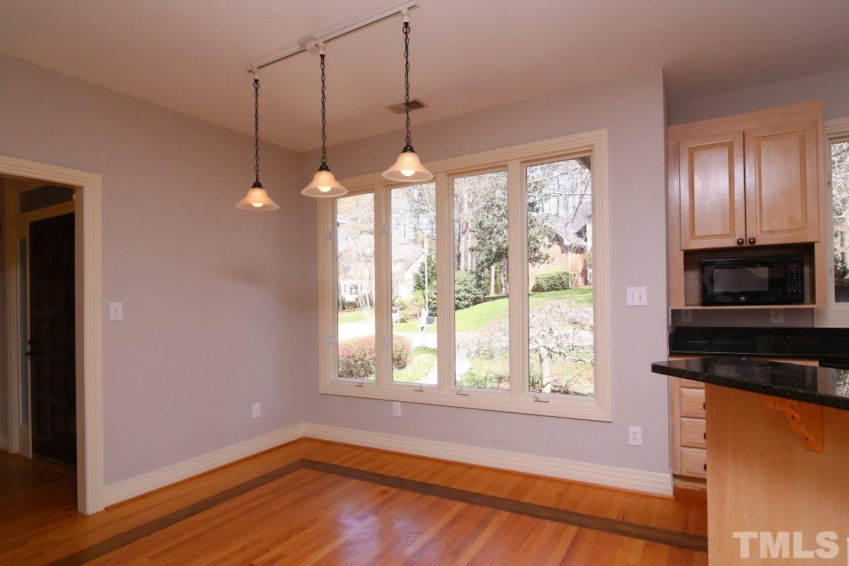8800 Old Tom Way Raleigh, NC 27613 - Photo 6 of 25 a view of a room with wooden floor and windows
