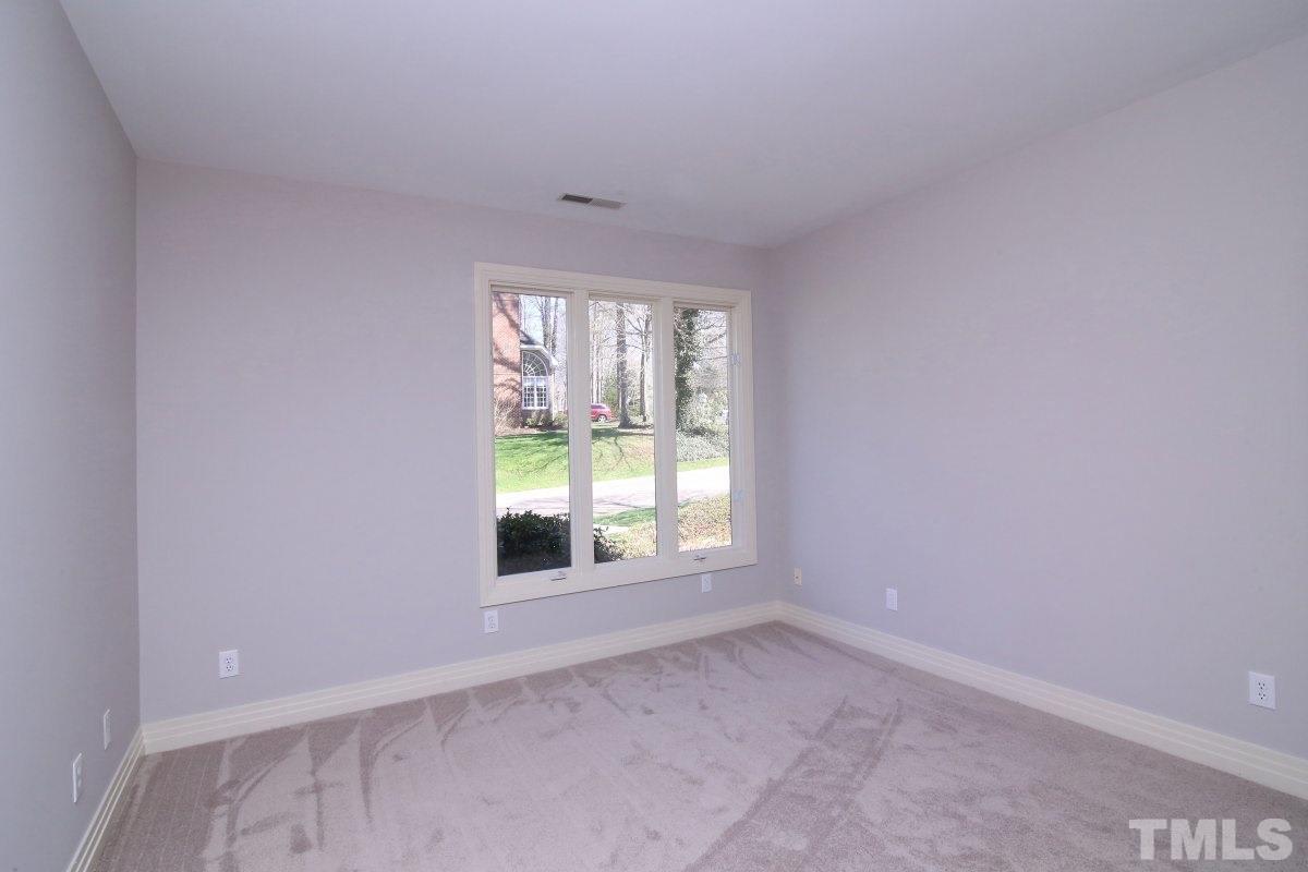 8800 Old Tom Way Raleigh, NC 27613 - Photo 10 of 25 an empty room with a window