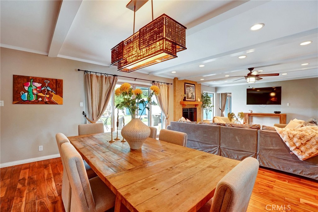 14955 Haynes Street Van Nuys, CA 91411 - Photo 11 of 35 a dining room with furniture a window and a flat screen tv